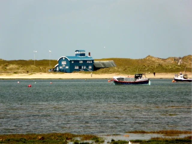 The old Lifeboat House on Blakeney Point seen across the harbour
