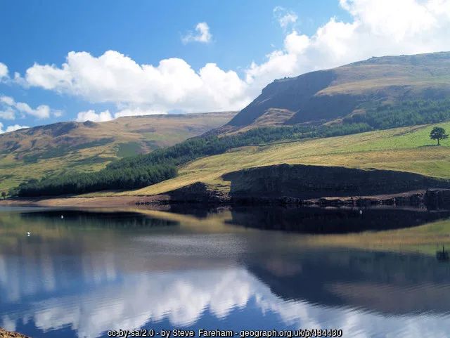 Dove Stone reservoir and surrounding hills in summer