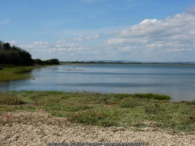 Tidal mudflats and water viewed from Church Norton across Pagham Harbour