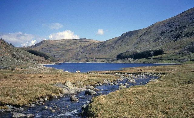 Mardale Beck flowing into Haweswater below open hills, photographed in April 1990