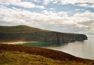 Rackwick Bay on Hoy, with green sea beneath the cliffs