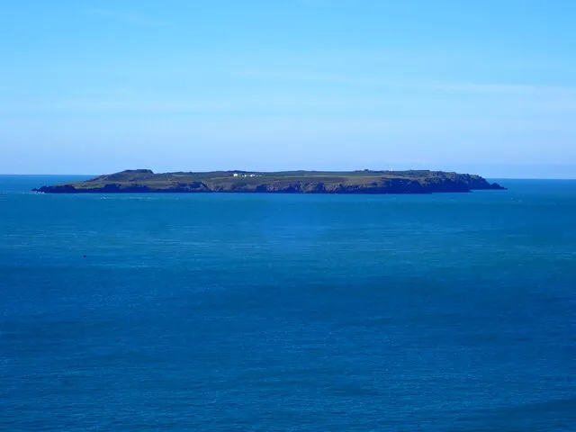 Skokholm Island and its white Observatory buildings seen from the Pembrokeshire coast