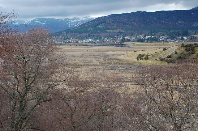 Insh Marshes wet grassland and River Spey floodplain with Kingussie beyond